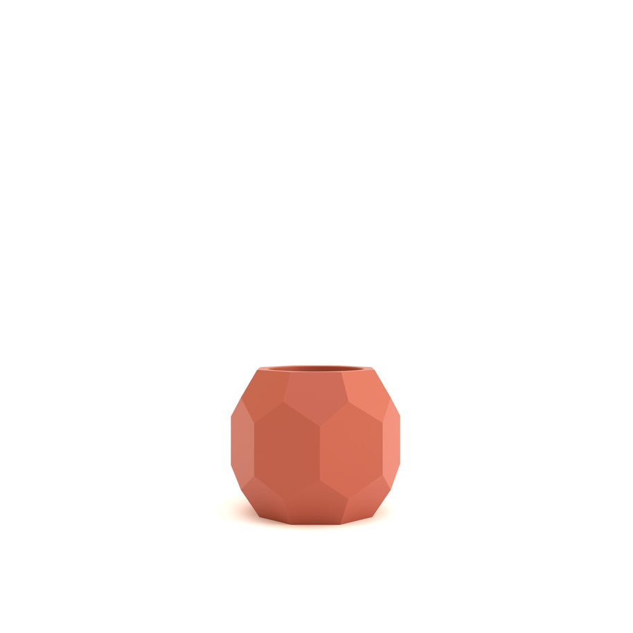 Terracotta-colored geometric pot on a white background