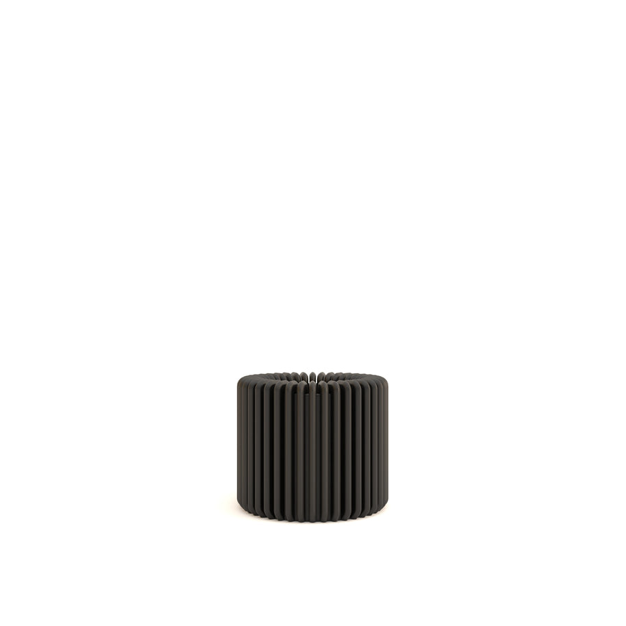 Black ribbed candle holder on a white background