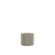 Textured cylindrical pot on a white background