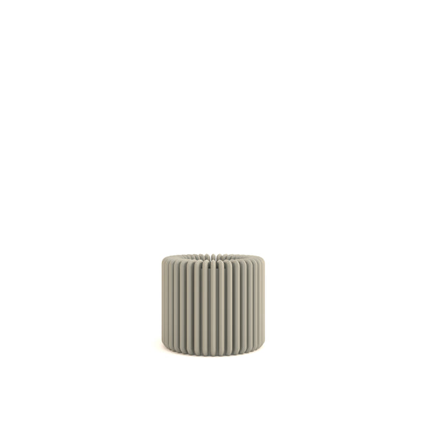 Textured cylindrical pot on a white background