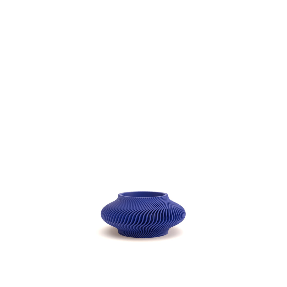 Blue textured vase on a white background