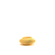 Yellow textured vase on a white background