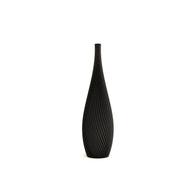 Black textured vase on a white background